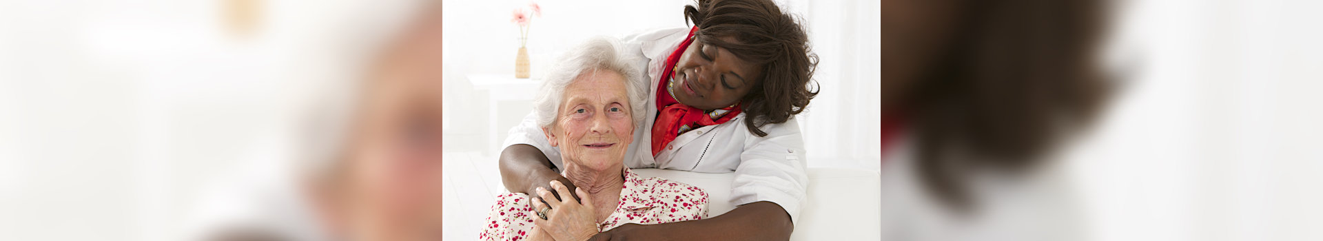 caregiver hugging her patient